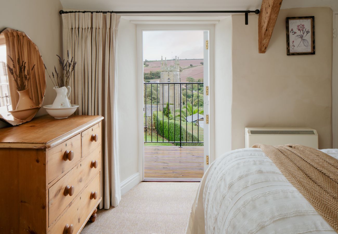 Bright double bedroom with a private balcony and scenic countryside views in South Milton.
